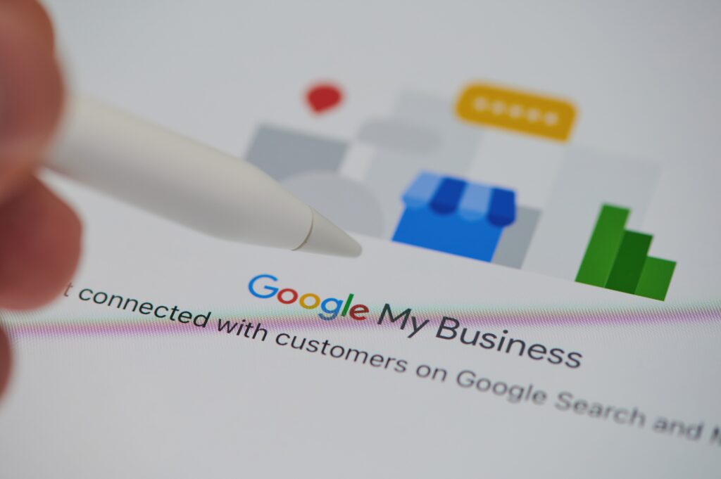 Close-up of Google My Business interface on a tablet with a stylus pen, illustrating local SEO tools and business profile optimization for digital marketing success.