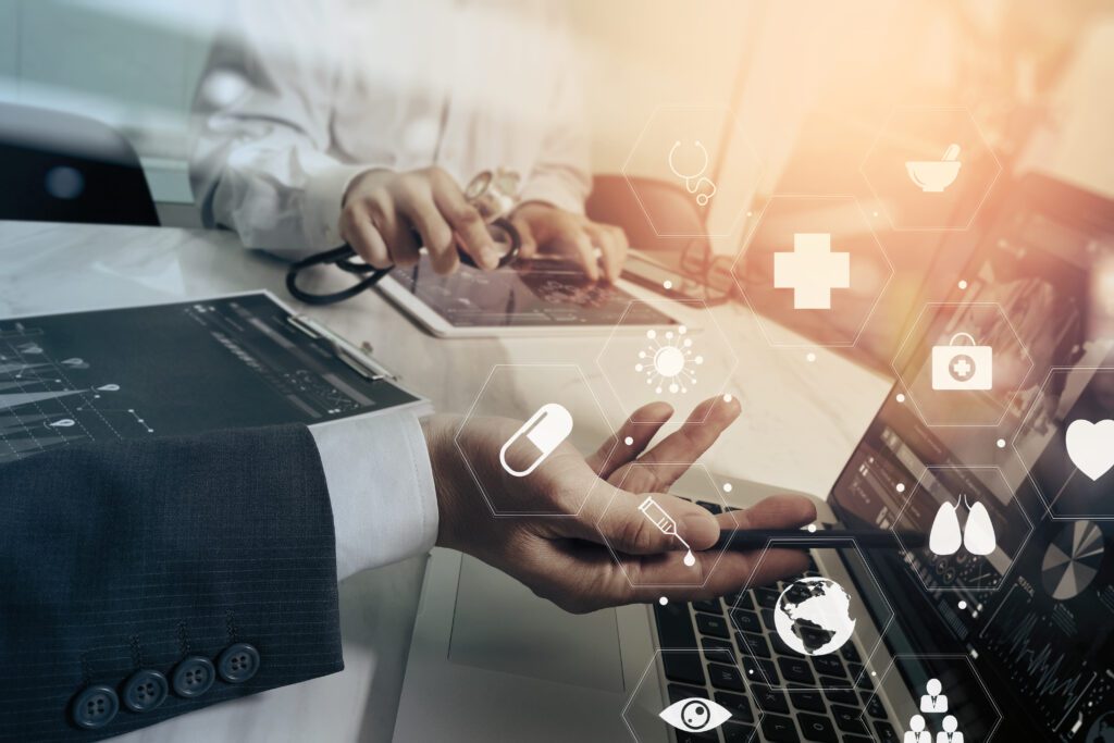 Close-up of business and medical professionals analyzing digital health data and icons, symbolizing health tech, data-driven strategy, and healthcare marketing innovation.