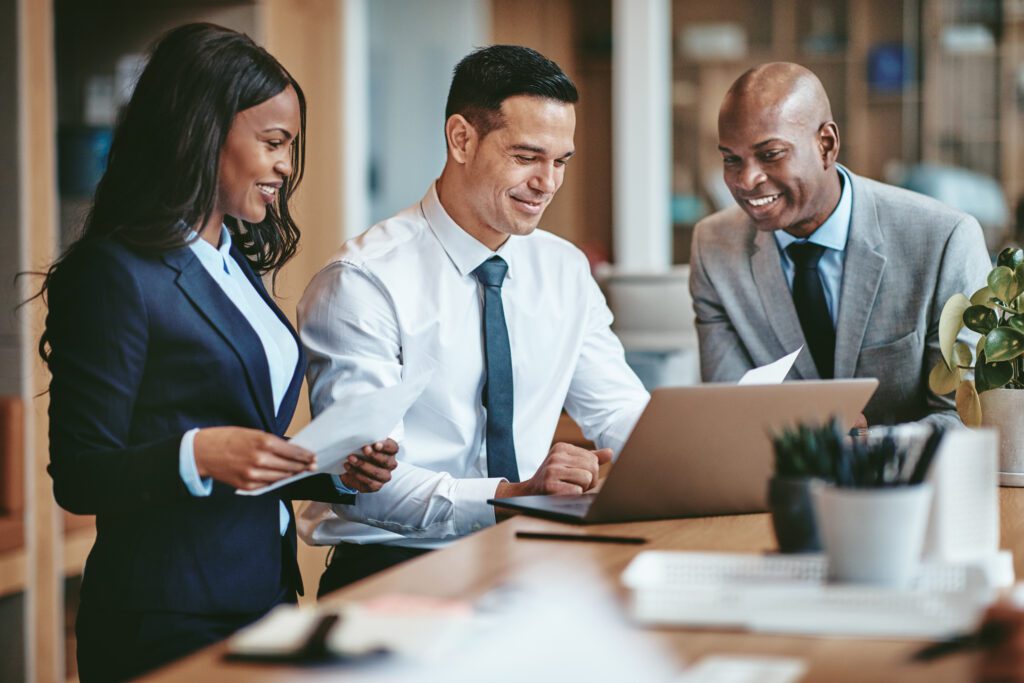 Diverse legal team collaborating on law firm blog content and digital marketing strategy, highlighting teamwork in attorney marketing and SEO-driven client engagement.