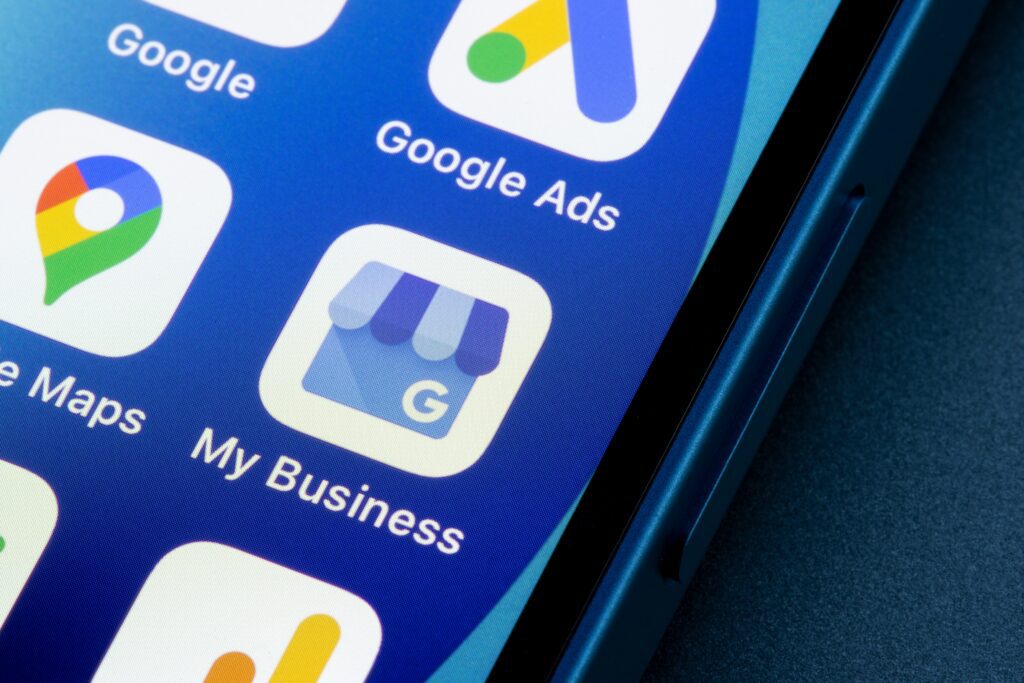 Google My Business and Google Ads app icons on smartphone, illustrating digital marketing tools for optimizing Local Service Ads for home service businesses.