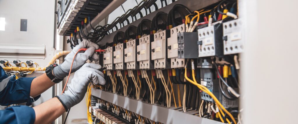 Professional electrician handling electrical wiring and circuit breakers, ideal visual for digital marketing strategies and YouTube advertising in local electrical services.