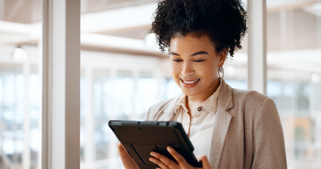 Lawyer or financial advisor reviewing email campaigns on a mobile app, leveraging B2B marketing tools and personalized content to engage a targeted professional services audience.