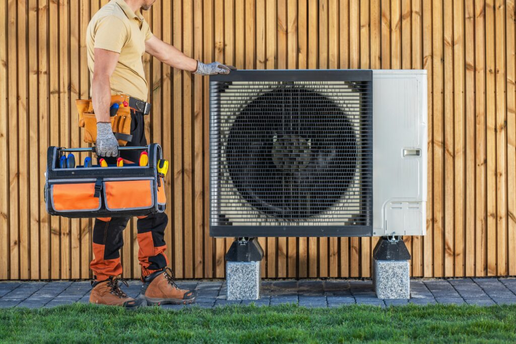 HVAC technician servicing outdoor AC unit, representing heating and cooling repair services, perfect for YouTube advertising campaigns and home services marketing content.
