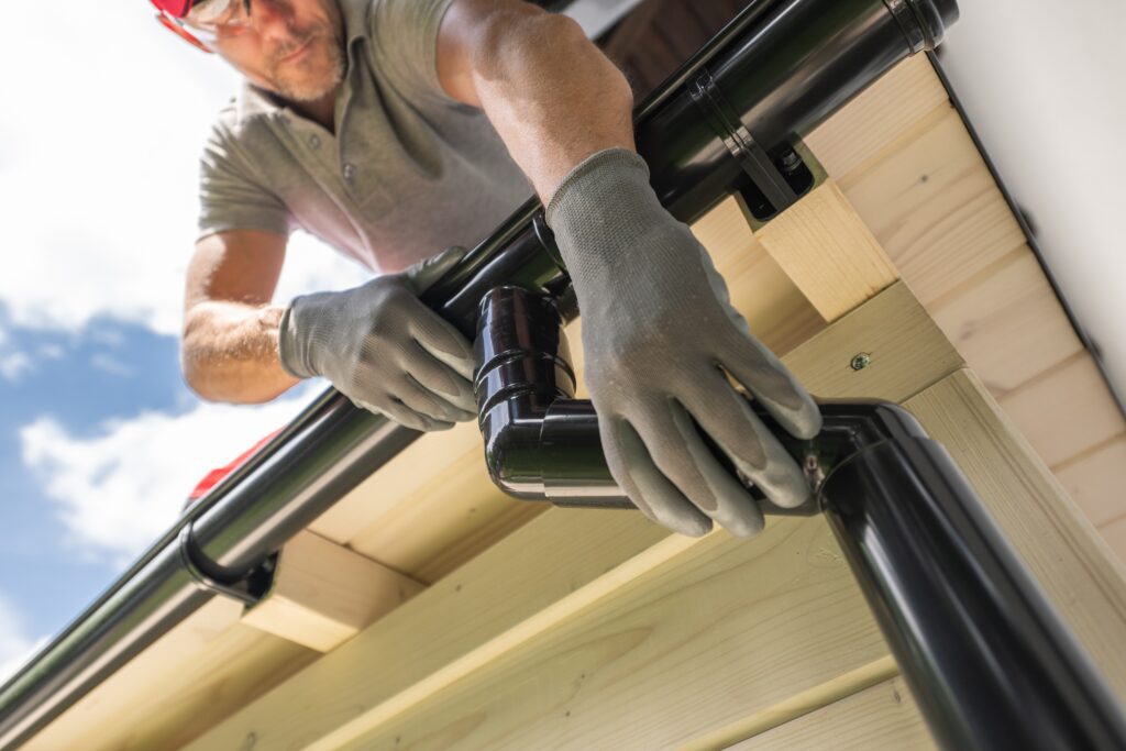 Roofers replacing shingles on a residential roof, highlighting lead generation for roofing companies using Google Local Service Ads and local SEO.