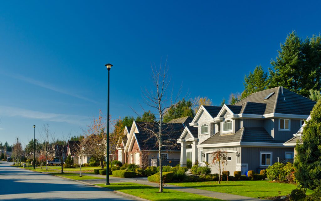 Beautiful suburban neighborhood on a sunny day, showcasing well-maintained homes—ideal target area for HVAC companies, electricians, plumbers, and other home services businesses using local SEO and targeted advertising