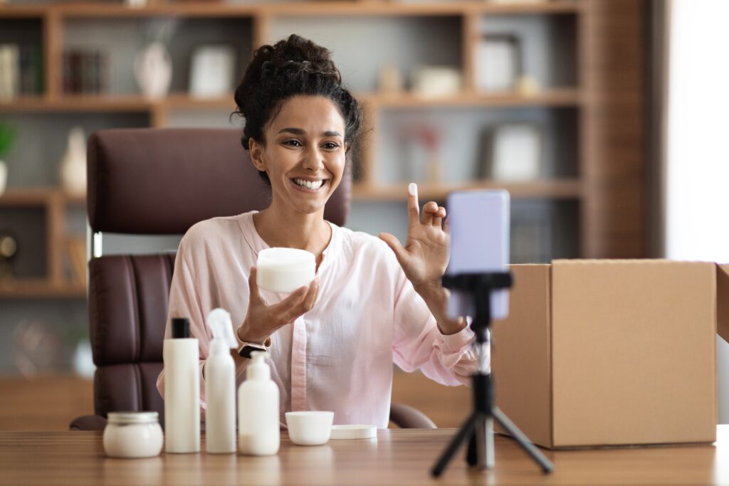 Beauty influencer creating UGC video for skincare product launch, enhancing ecommerce content strategy, customer experience, and social proof through authentic testimonials.