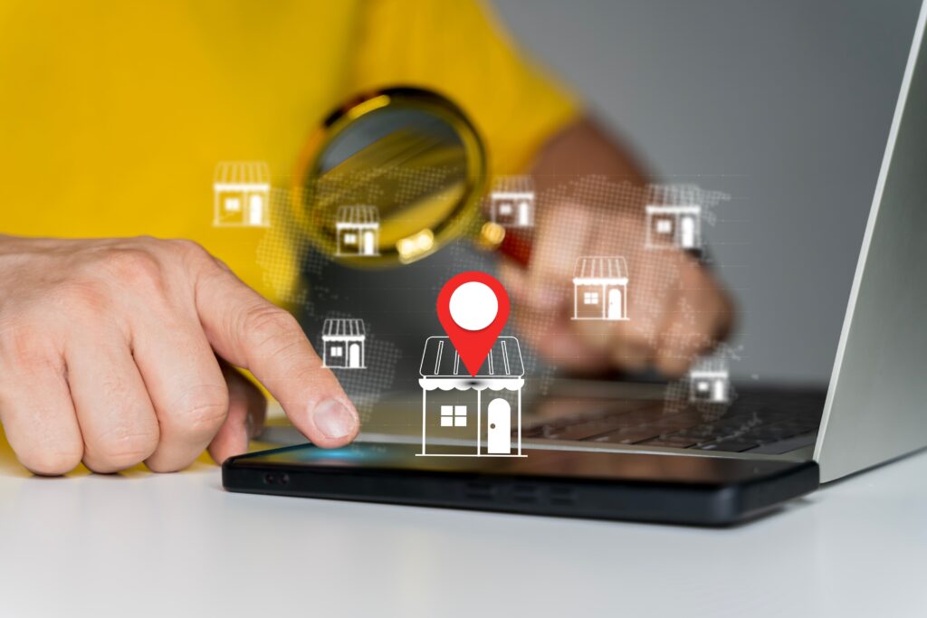 User interacting with online store locator on laptop, representing omnichannel retail strategy, customer experience, and integration of brick and mortar with digital ecommerce platforms.