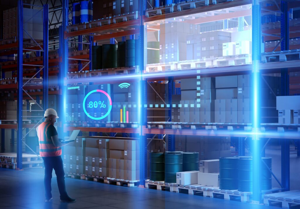 Technician monitoring smart warehouse system with inventory dashboard—representing automation, predictive analytics, ecommerce fulfillment software, and data-driven backend operations for efficient order fulfillment and warehouse optimization.