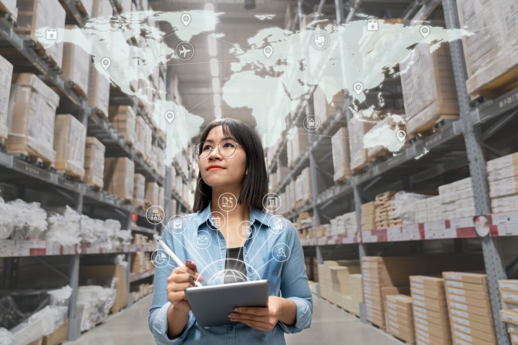 Ecommerce supply chain manager using a tablet to analyze global logistics and SEO analytics for backlink strategy, search engine optimization, and brand visibility.