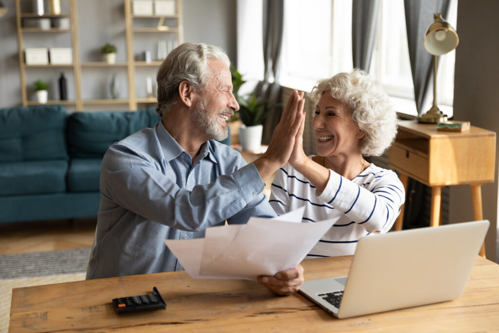 Happy homeowners celebrating successful home improvement project results, representing high customer satisfaction, positive reputation, and strong customer retention in the home services industry.