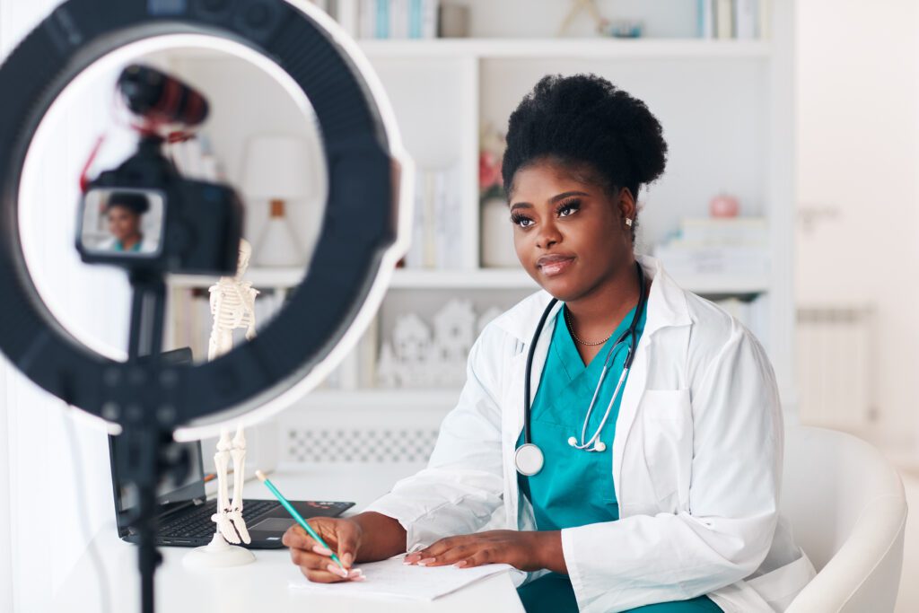 Medical professional recording health education content for TikTok or Instagram using a ring light and camera, demonstrating healthcare marketing, social media strategy, and digital transformation in the medical field.