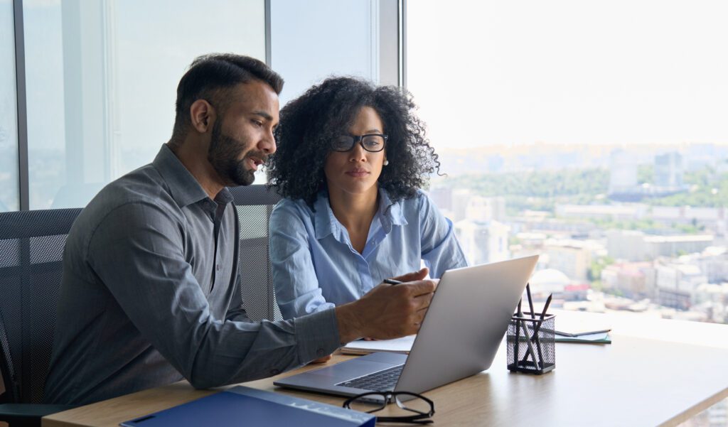 Business professionals collaborating on a lead generation strategy, analyzing data and marketing analytics to increase brand awareness and generate qualified leads for professional services.