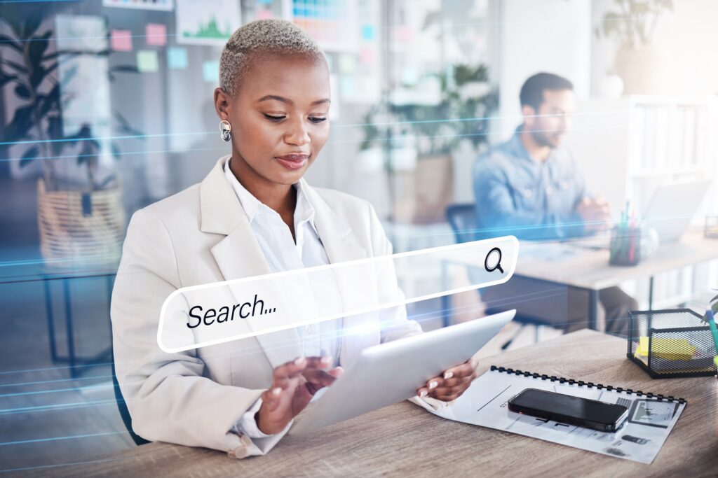 Business professional researching home service SEO strategies and local search optimization on a tablet to enhance online visibility and lead generation.