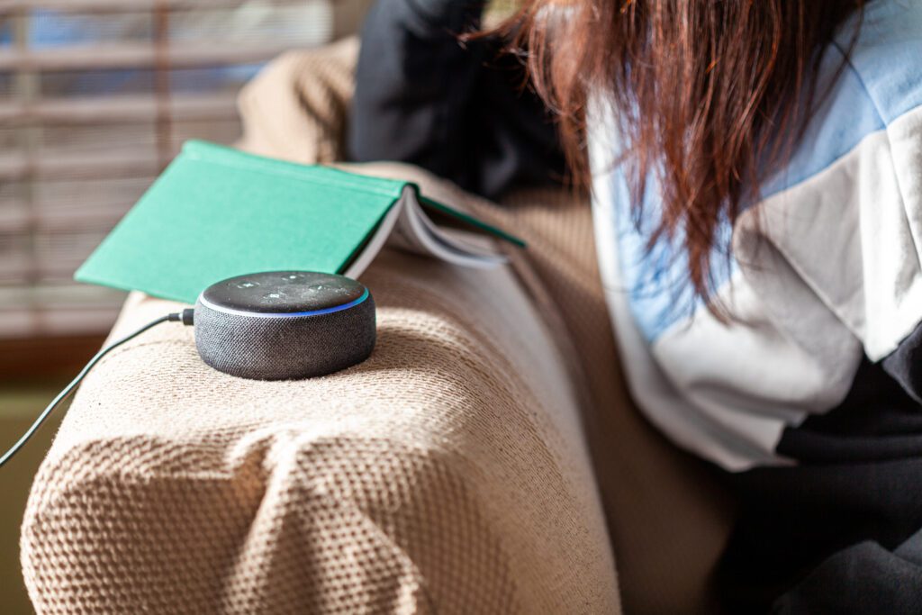 Smart speaker voice search device helping customers find HVAC companies, plumbers, and electricians through optimized answer engine content and home service SEO