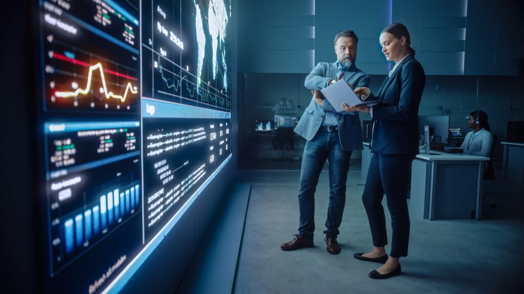 Business professionals analyzing search engine results page data, AI search insights, and digital marketing performance metrics to improve brand visibility and organic search results for professional services.