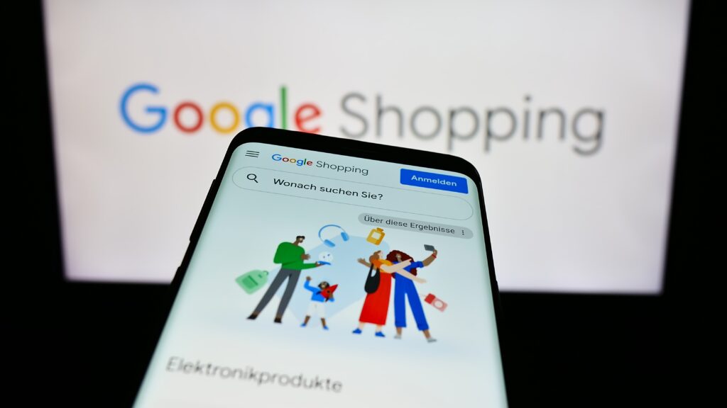 Smartphone displaying the Google Shopping app interface in German with search bar for electronics, representing ecommerce, zero-click purchasing, and online retail marketing.