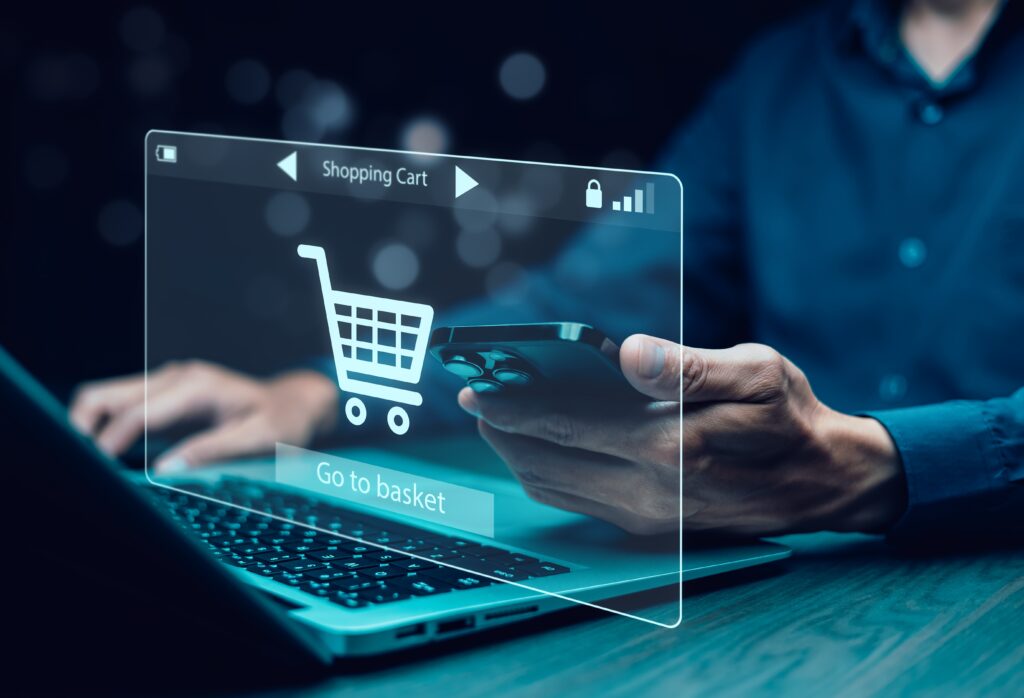 Ecommerce shopper reviewing online shopping cart on mobile device, representing abandoned cart recovery strategies through marketing automation and email campaigns.